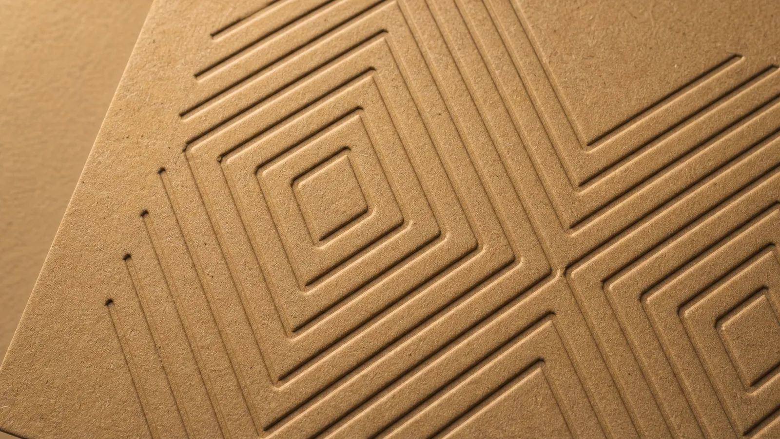 Recessed debossed pattern on kraft paperboard